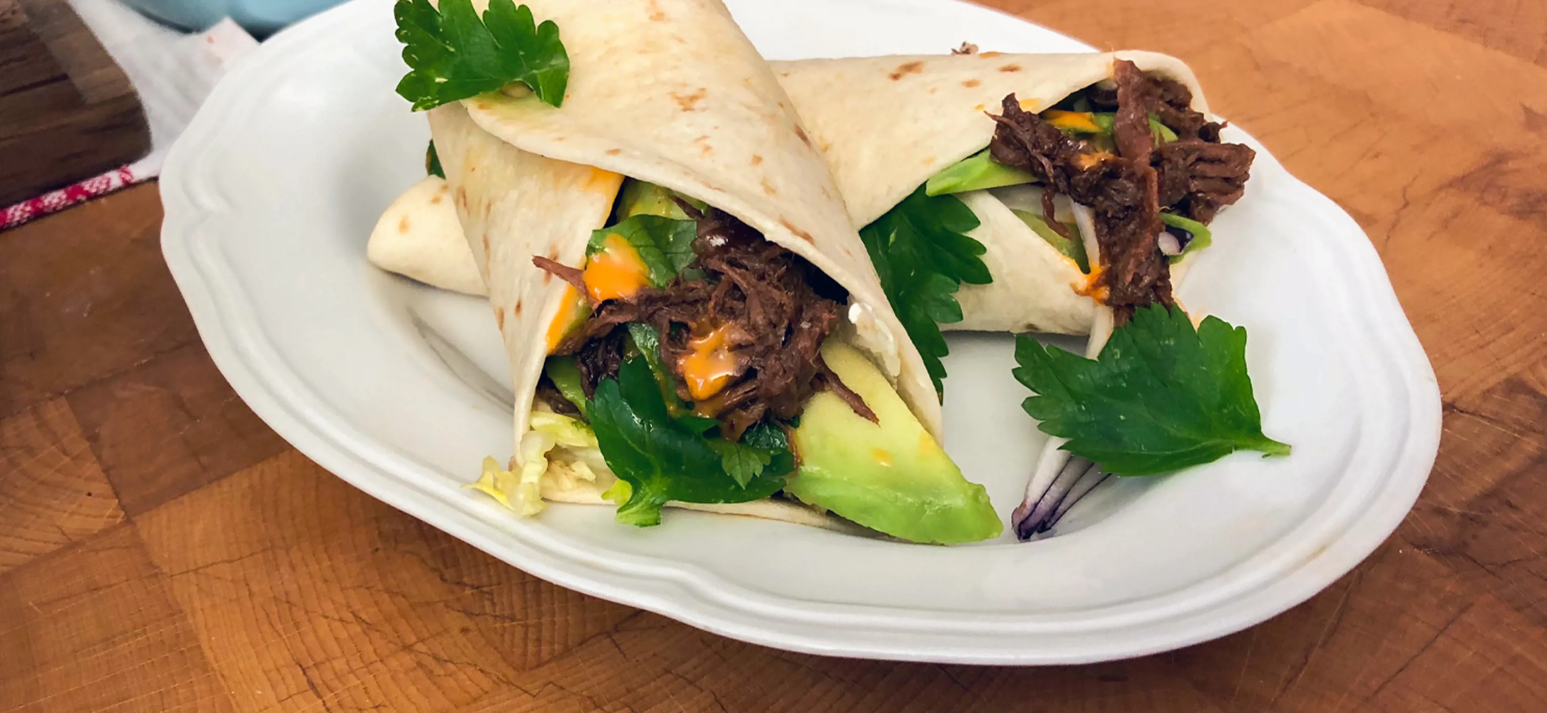 Roasted wild boar wrap in spicy tortilla