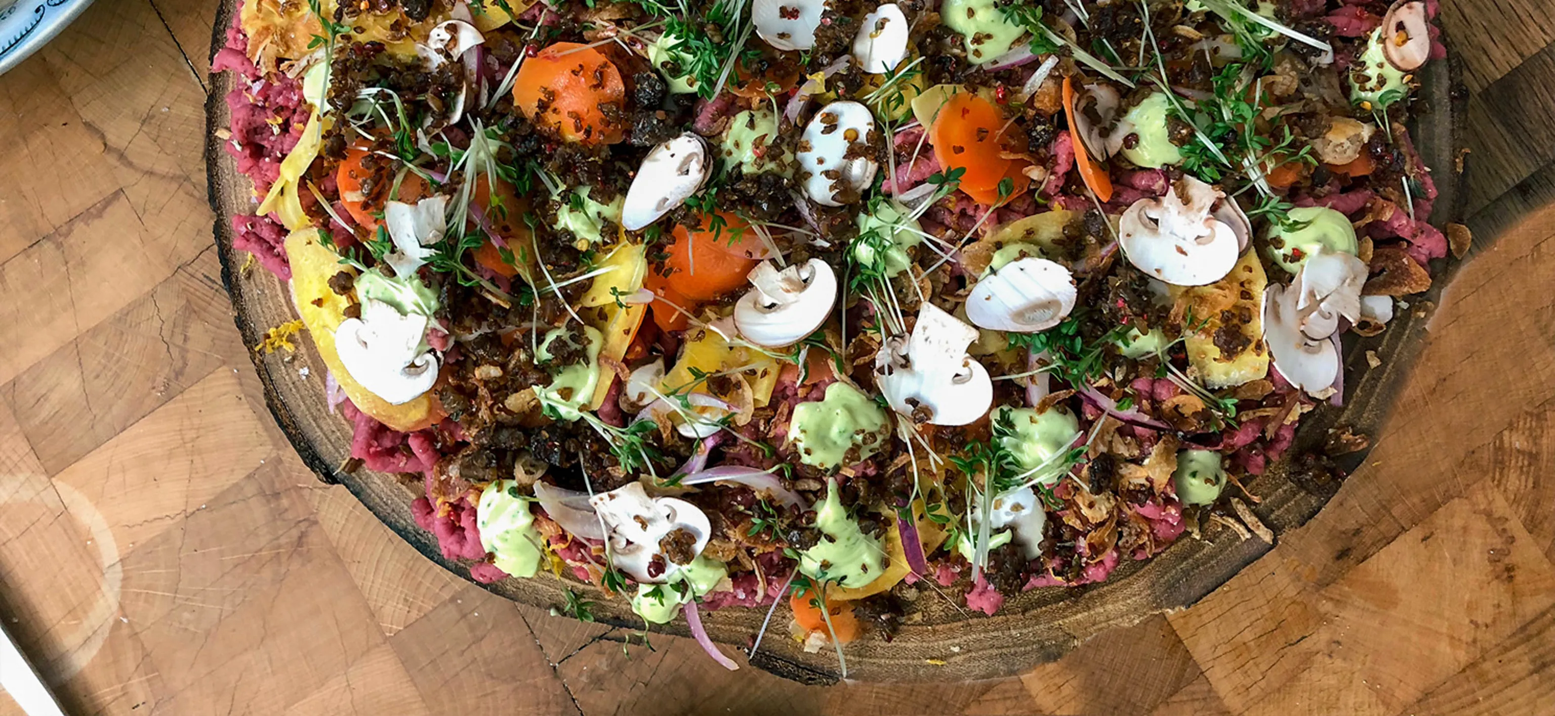 Moose tartar with jalapeño, onion, rye crisps, and carrots