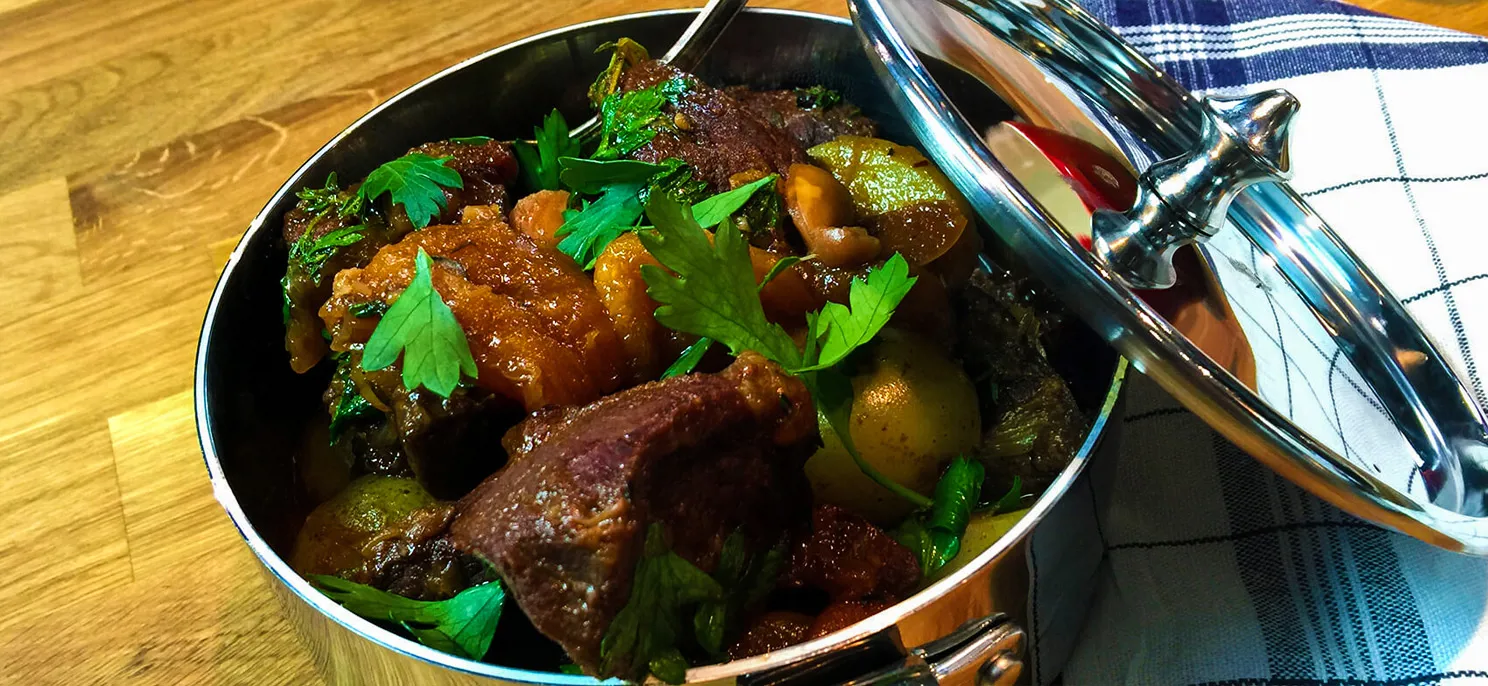 Wild boar stew with apricots, almonds and juniper berries