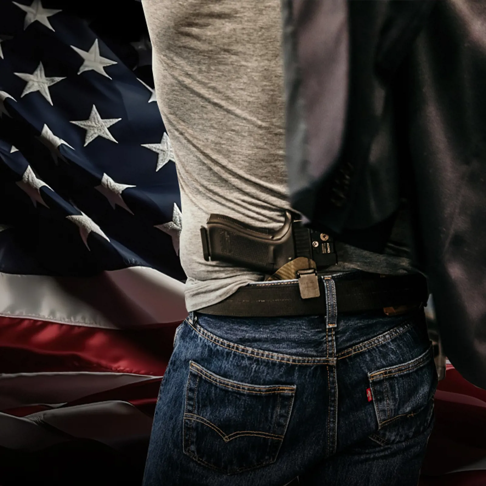 Man and an american flag with a concealed pistol